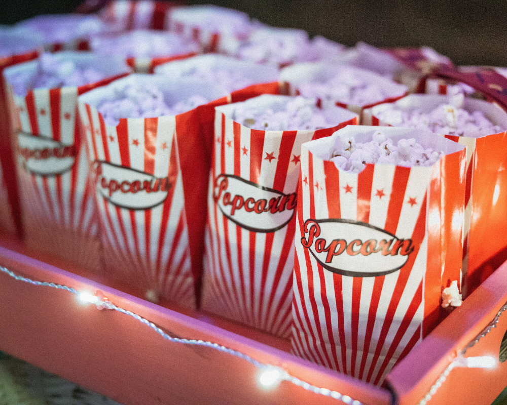 Rows of popcorn in red and white bags.