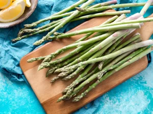 Fresh asparagus on a wooden cutting board