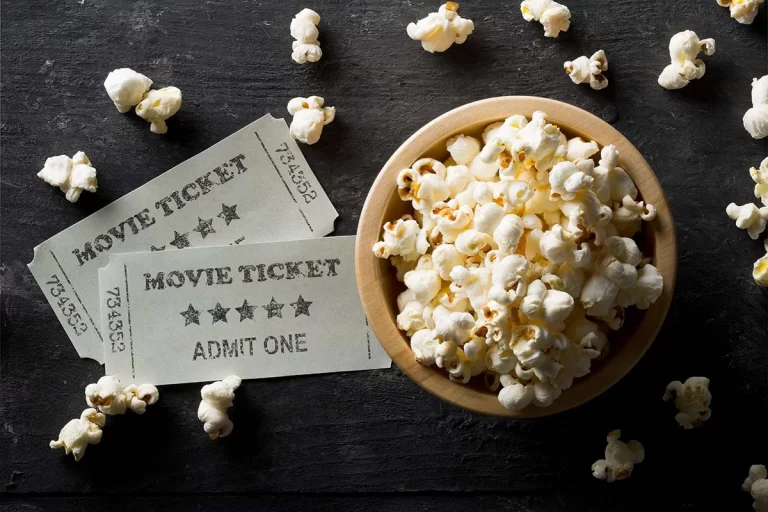 Popcorn bowl with two movie tickets