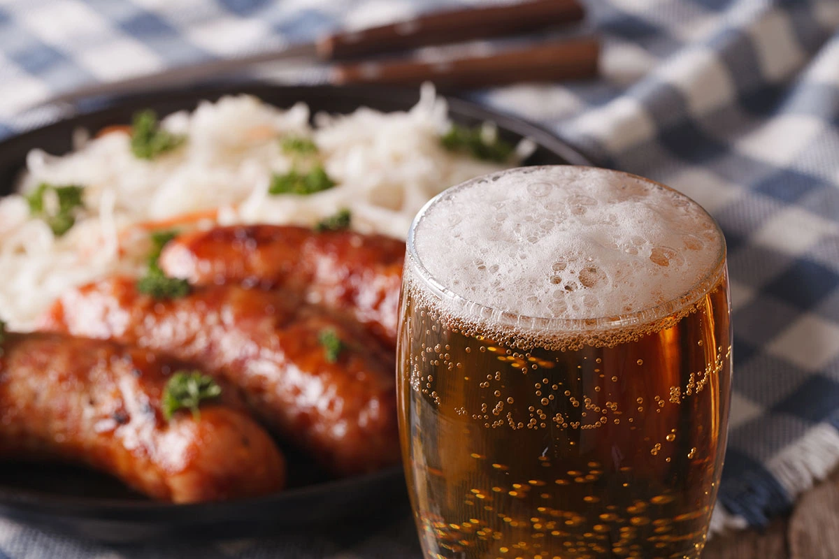 Sausage, sauerkraut, and a bear together to make the perfect Oktoberfest meal