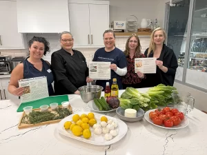 Maria with Alzheimers Team and Chef Bev together cooking up connection