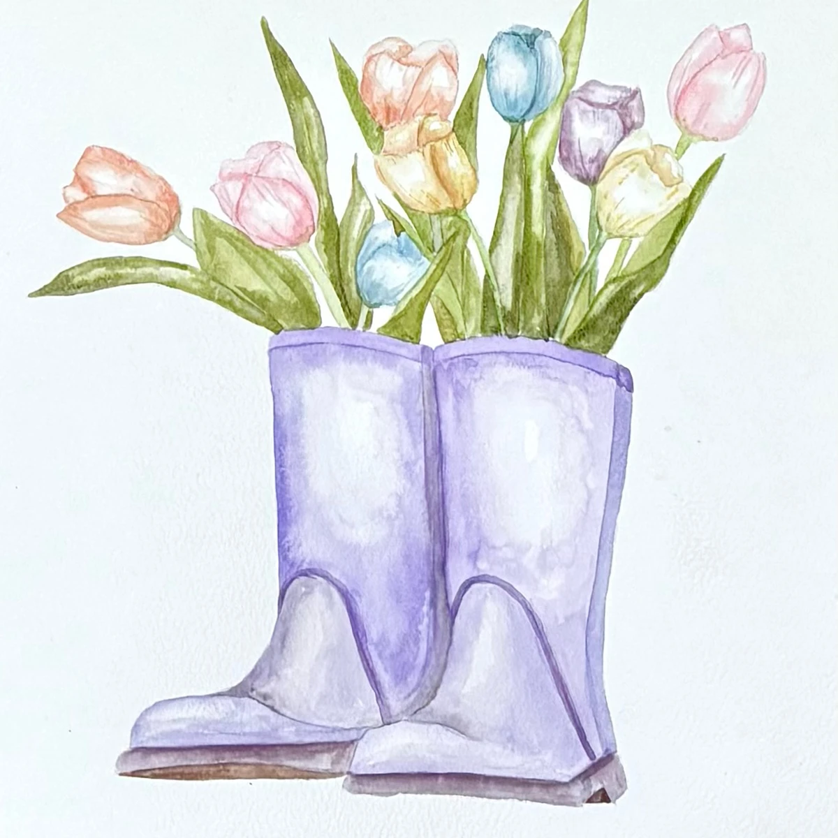 A watercolor painting of a pair of blue rubber boots with blooming tulips inside